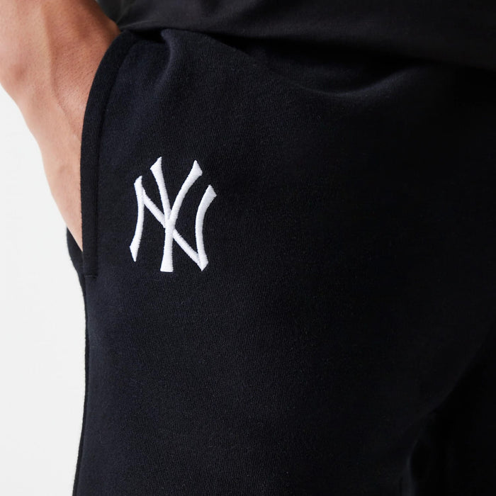 The Male model is wearing New York Yankees MLB League Essential Black Shorts 4