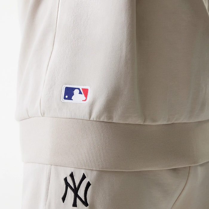 The Male model is wearing New York Yankees MLB League Essential Cream Crew Neck Sweater 6
