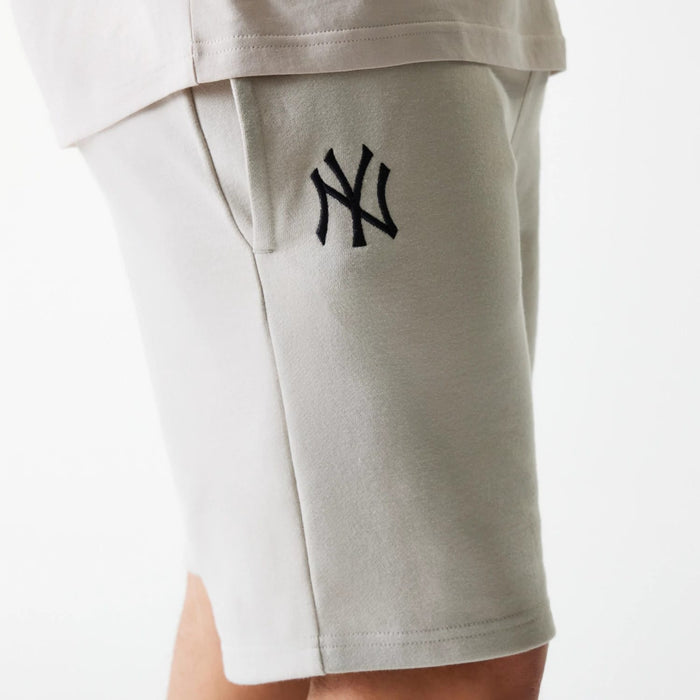 The Male model is wearing New York Yankees MLB League Essential Cream Shorts 5