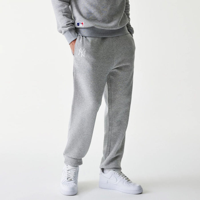 The Male model is wearing New York Yankees MLB League Essential Grey Joggers 1