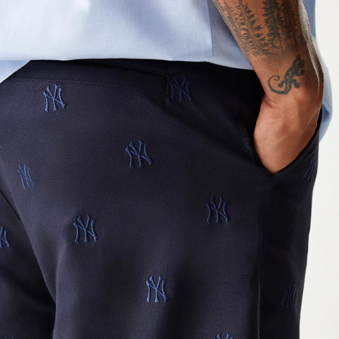 The Male model is wearing New York Yankees MLB Monogram Navy Shorts 7