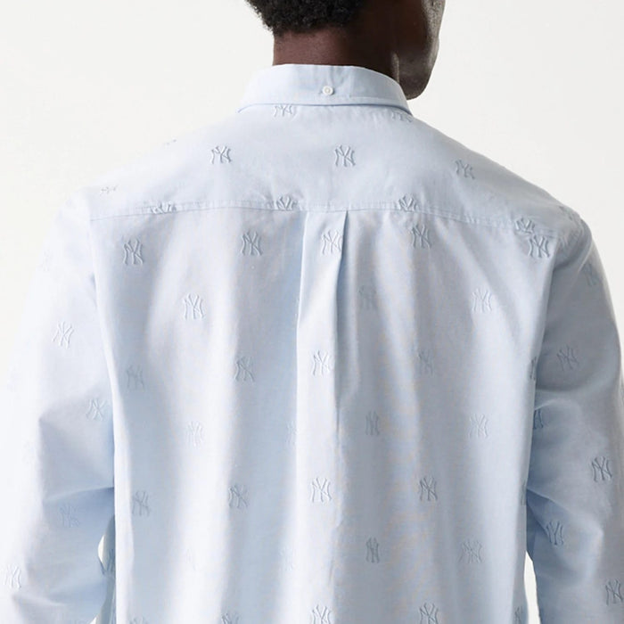 The Male model is wearing New York Yankees MLB Monogram Pastel Blue Long Sleeve Shirt 5