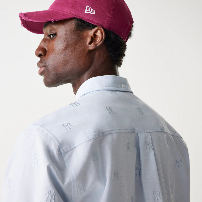The Male model is wearing New York Yankees MLB Monogram Pastel Blue Long Sleeve Shirt 6