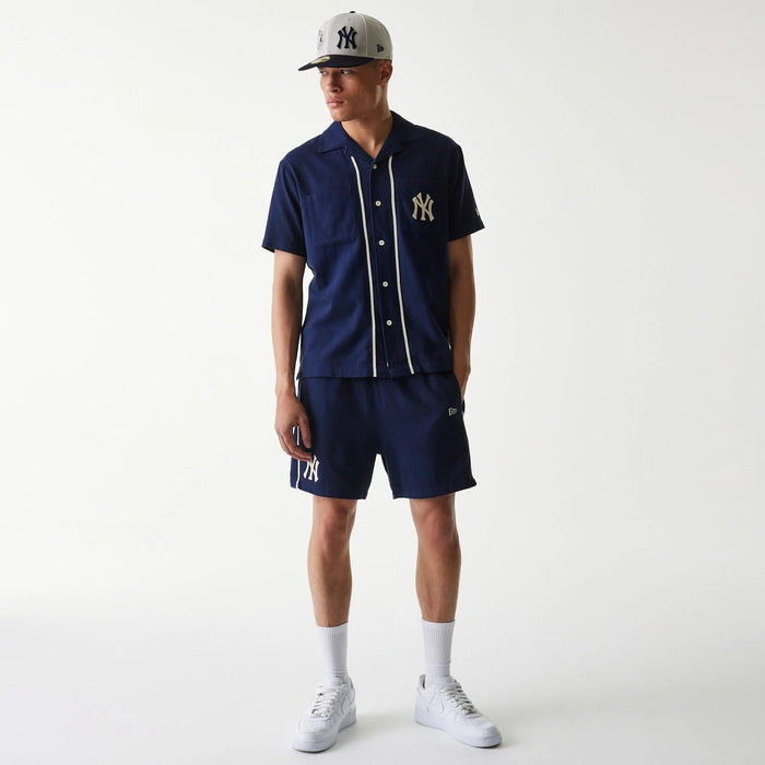 The Male model is wearing New York Yankees MLB Piping Navy Short Sleeve Shirt 8