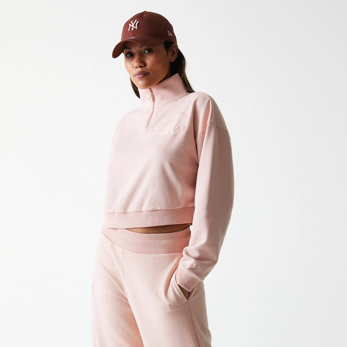 The Female model is wearing New York Yankees Womens MLB Tonal Pastel Pink Cropped 1/4 Zip Sweater 3