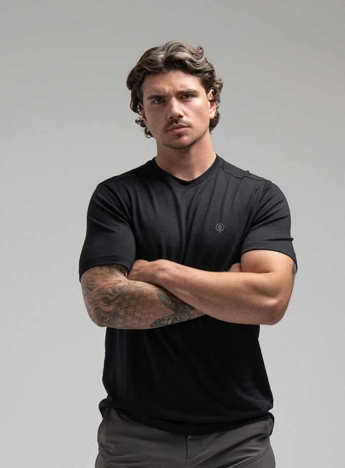 Jack Is 6ft 3" And Wears Size: L | Hem Studio Image Of Model Wearing Oryon 72Hr Merino T-Shirt In Obsidian Black (SS Model)