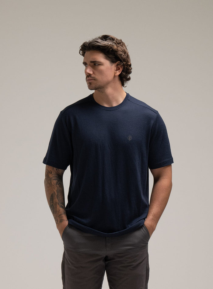 Jack Is 6ft 3" And Wears Size: L | Hem Studio Image Of Model Wearing Oryon 72Hr Merino T-Shirt In Dark Sapphire (SS Model)