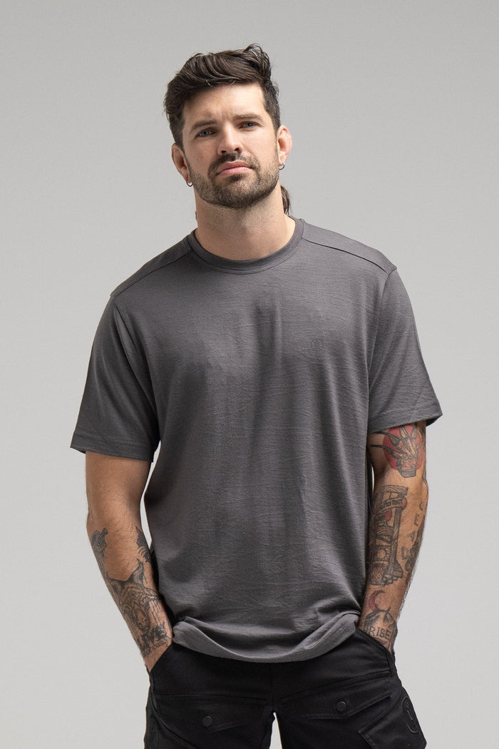 Bernie Is 6ft And Wears Size: M | Hem Studio Image Of Model Wearing Oryon 72Hr Merino T-Shirt In Grey (SS Model)