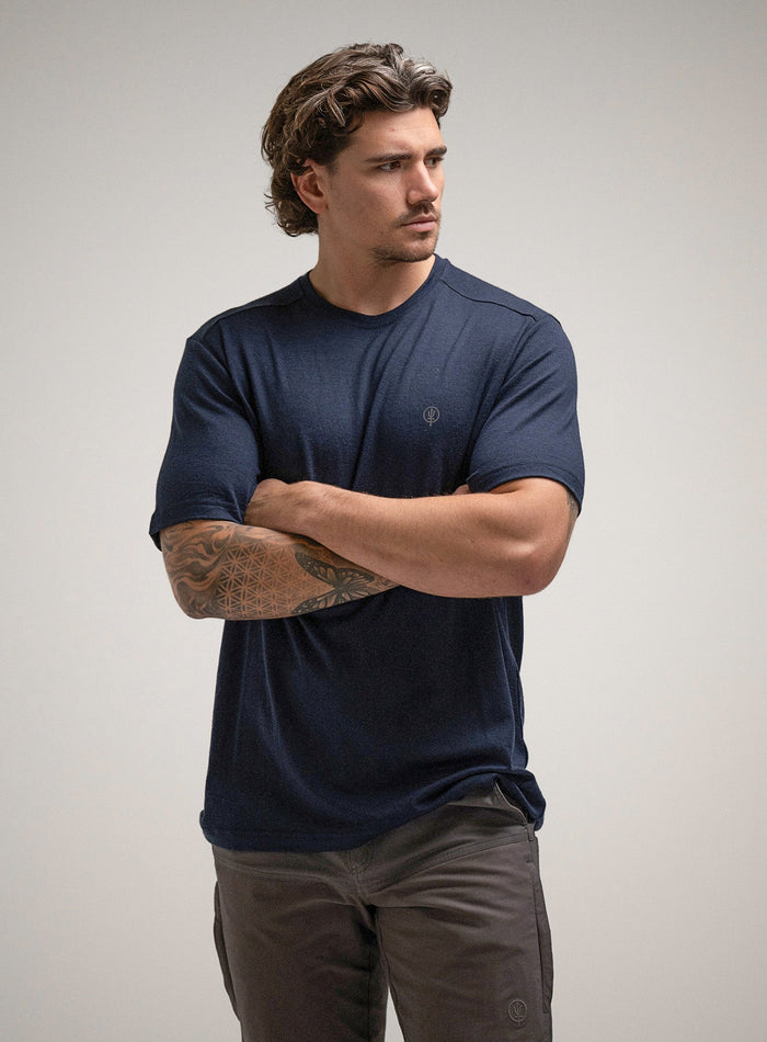 Jack Is 6ft 3" And Wears Size: L | Hem Studio Image Of Model Wearing Oryon 72Hr Merino T-Shirt In Dark Sapphire (SS Model)