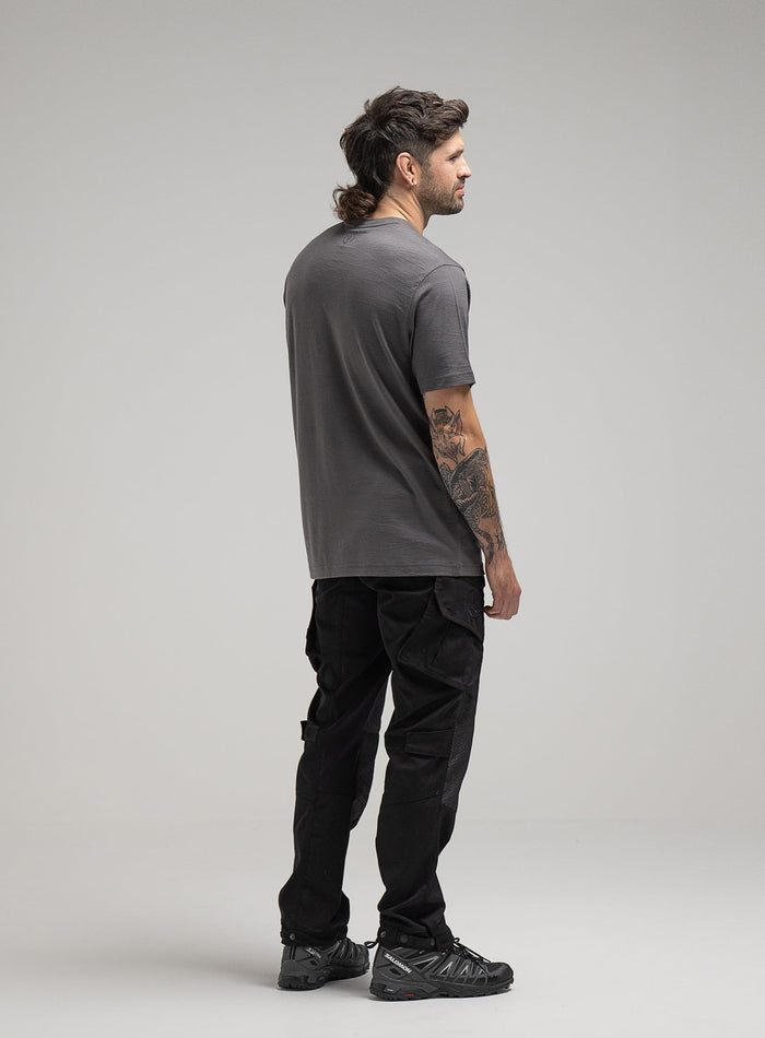 Bernie Is 6ft And Wears Size: M | Hem Studio Image Of Model Wearing Oryon 72Hr Merino T-Shirt In Grey (SS Model)