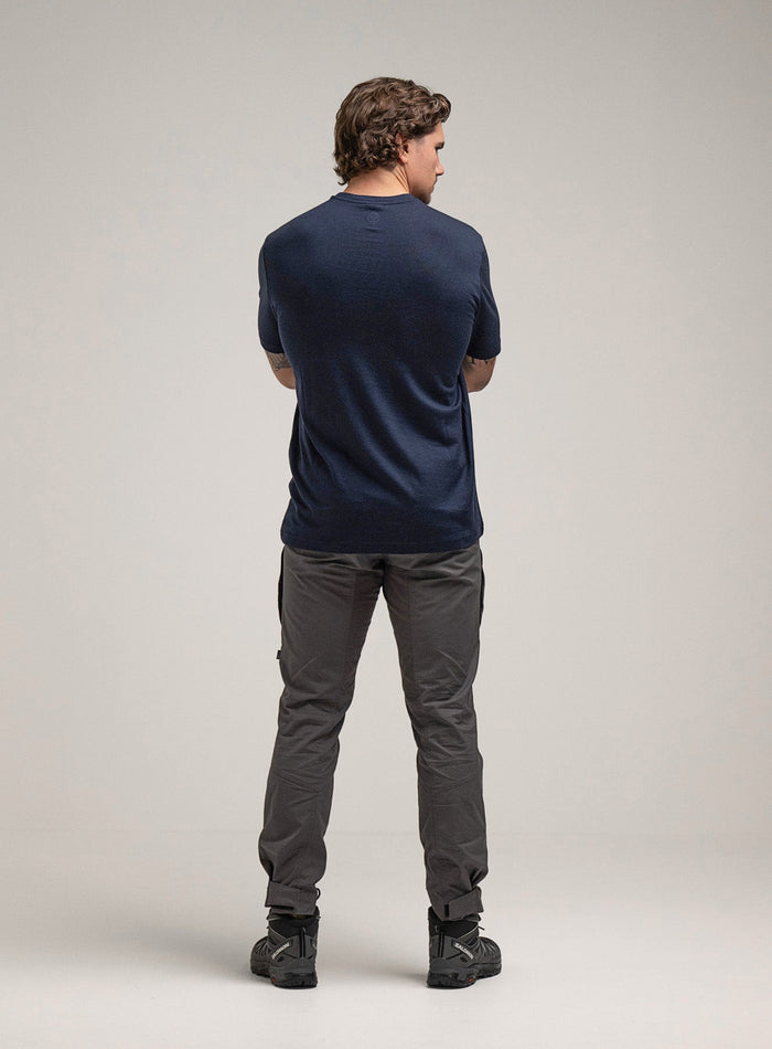 Jack Is 6ft 3" And Wears Size: L | Hem Studio Image Of Model Wearing Oryon 72Hr Merino T-Shirt In Dark Sapphire (SS Model)