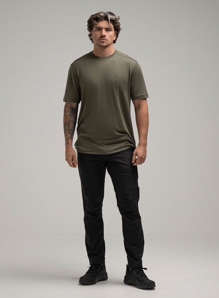 Jack Is 6ft 3" And Wears Size: L | Hem Studio Image Of Model Wearing Oryon 72Hr Merino T-Shirt In Green (SS Model)