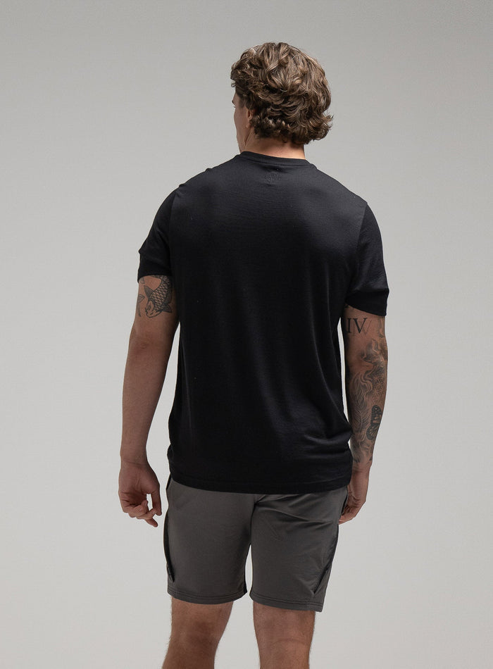 Jack Is 6ft 3" And Wears Size: L | Hem Studio Image Of Model Wearing Oryon 72Hr Merino T-Shirt In Obsidian Black (SS Model)