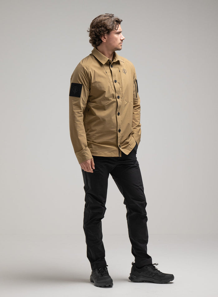 Jack Is 6ft 3" And Wears Size: L | Hem Studio Image Of Model Wearing Oryon Carbon Shirt In Sand (SS Model)