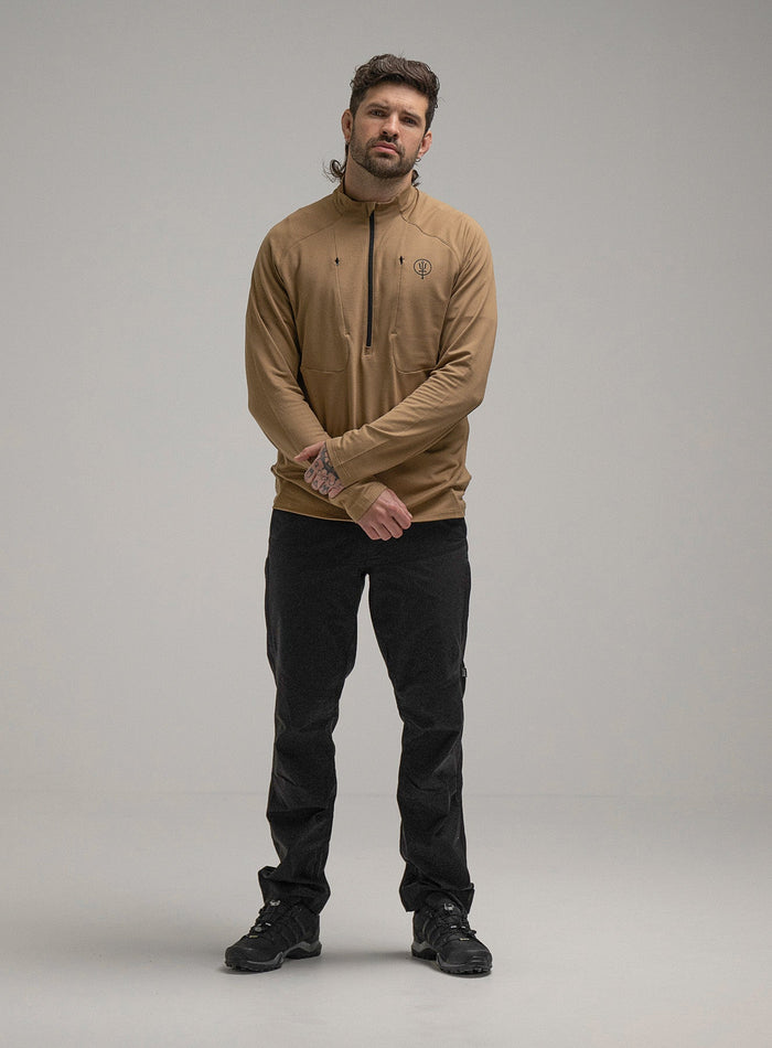 Bernie Is 6ft And Wears Size: M | Hem Studio Image Of Model Wearing Oryon Delta Long Sleeve T-Shirt In Sand (SS Model)