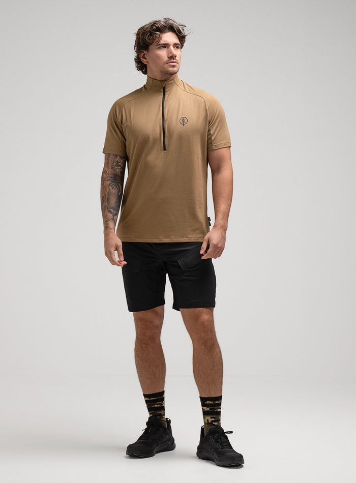 Jack Is 6ft 3" And Wears Size: L | Hem Studio Image Of Model Wearing Oryon Delta T-Shirt In Sand (SS Model)