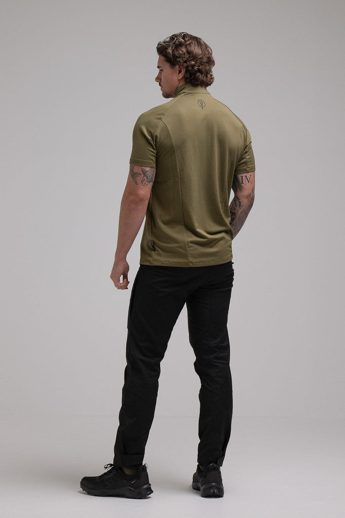 Jack Is 6ft 3" And Wears Size: L | Hem Studio Image Of Model Wearing Oryon Delta T-Shirt In Green (SS Model)