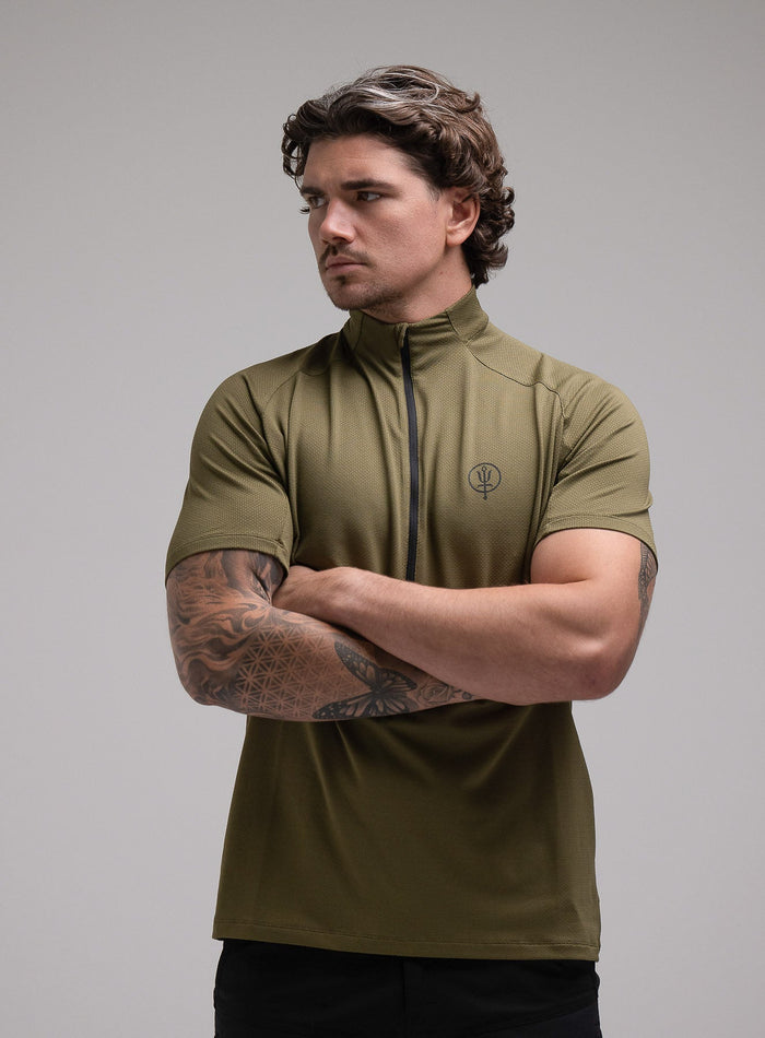 Jack Is 6ft 3" And Wears Size: L | Hem Studio Image Of Model Wearing Oryon Delta T-Shirt In Green (SS Model)