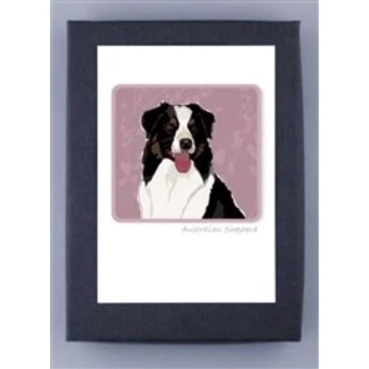 PAPER RUSSELLS - AUSTRALIAN SHEPHERD NOTE CARDS feature a black, white, and brown Aussie with its tongue out on a mauve background in a dark frame—ideal for eco-friendly stationery or recycled paper notecards by PAPER RUSSELLS.