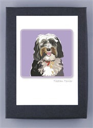 PAPER RUSSELLS - TIBETAN TERRIER BOXED CARDS feature a cheerful black, white, and brown Tibetan Terrier with a fluffy coat and tongue out against a purple background—ideal for fans of eco-friendly stationery or recycled paper notecards.