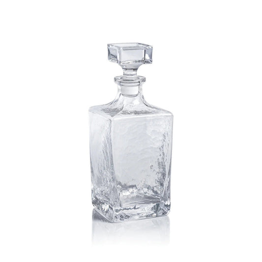 The ZODAX PUNTA MITA Hammered Glass Decanter is a clear, rectangular 32 oz vessel with a square faceted stopper and textured glossy finish, shown against a plain white background.