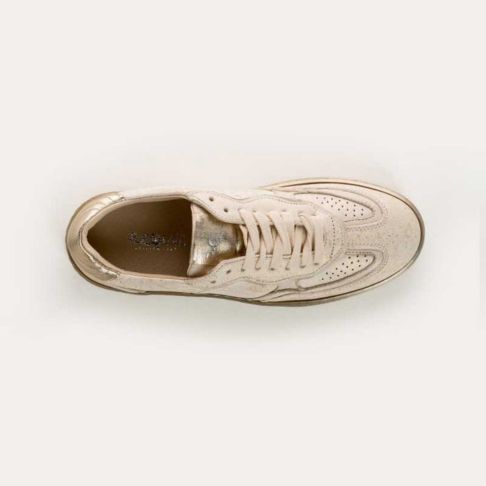 The REQINS ATHENA GLAM sneaker in platinum off white features suede leather, a textured sole, and stitched details, displayed from the side against a plain light background.