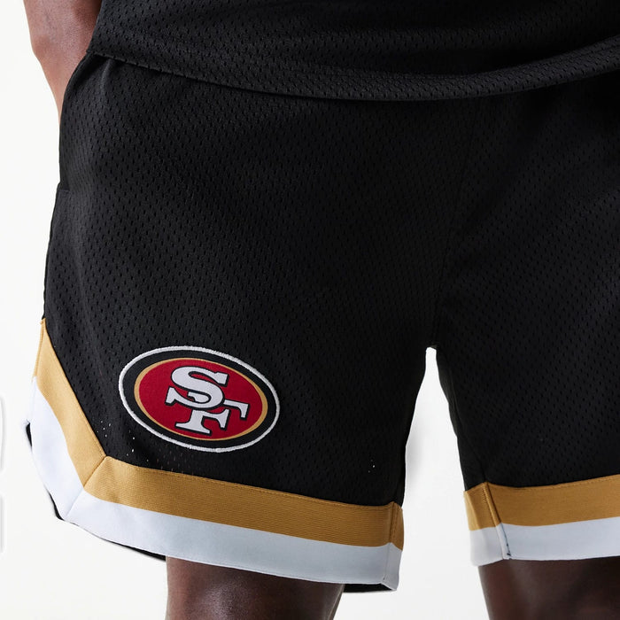 The Male model is wearing San Francisco 49ers NFL Mesh Black Shorts 3
