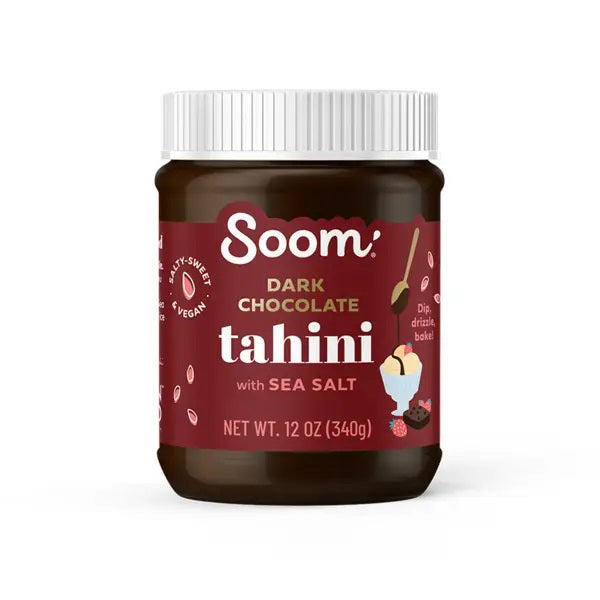 A 12 oz (340g) jar of SOOM FOODS SOOM - DARK CHOCOLATE SEA SALT TAHINI with a maroon label and white lid, featuring chocolate, seeds, a dessert image, and labeled dairy-free and vegan.