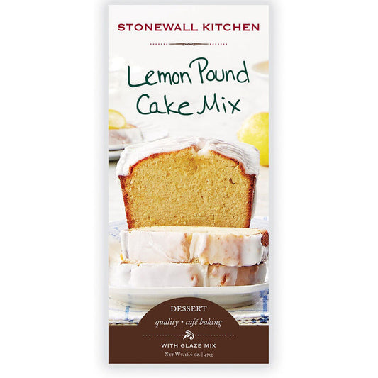 A package of STONEWALL KITCHEN - LEMON POUND CAKE MIX from Stonewall Kitchen showcases a tempting image of a glazed lemon pound cake with a slice cut and standing prominently in front. The packaging emphasizes the dessert's tangy lemon glaze, making it an ideal treat. The net weight is 16.6 oz (470 grams).