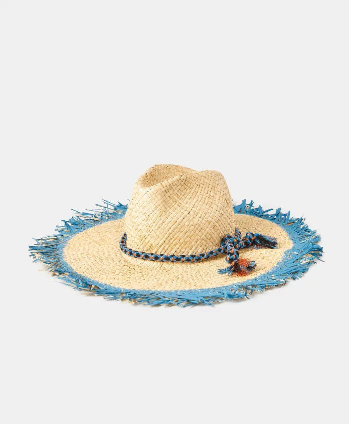 The MOMONI TALLULAH RAFIA SUMMER HAT, crafted in Italy from natural raffia, features a wide fringed brim with a frayed blue edge and a blue braided crown band, displayed on a plain light background.