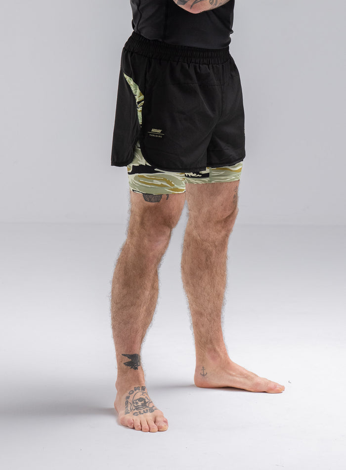 Staz Is 5ft 8" And Wears Size: S | Hem Studio Image Of Model Wearing Thrudark X Scramble No Gi Shorts In Obsidian Black (SS Model)