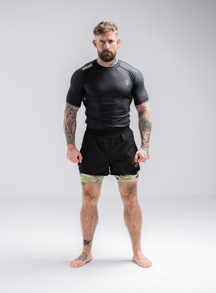 Staz Is 5ft 8" And Wears Size: S | Hem Studio Image Of Model Wearing Thrudark X Scramble No Gi Shorts In Obsidian Black (SS Model)