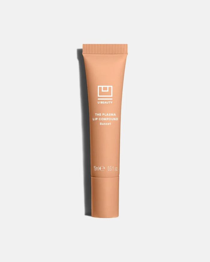 A light gray tube labeled "U BEAUTY - THE PLASMA LIP COMPOUND 15ML" with a screw cap stands upright on a white background, offering advanced hydration and plumping for lips. Brand: U BEAUTY.