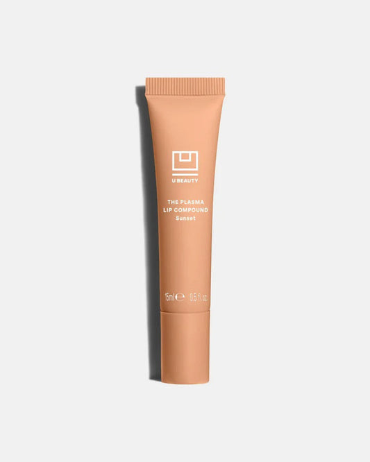 A light gray tube labeled "U BEAUTY - THE PLASMA LIP COMPOUND 15ML" with a screw cap stands upright on a white background, offering advanced hydration and plumping for lips. Brand: U BEAUTY.