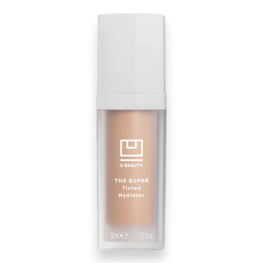 A rectangular bottle of U BEAUTY THE SUPER TINTED HYDRATOR SHADE 05 features a white cap and label with light beige tinted moisturizer inside, displaying the brand logo and product details.