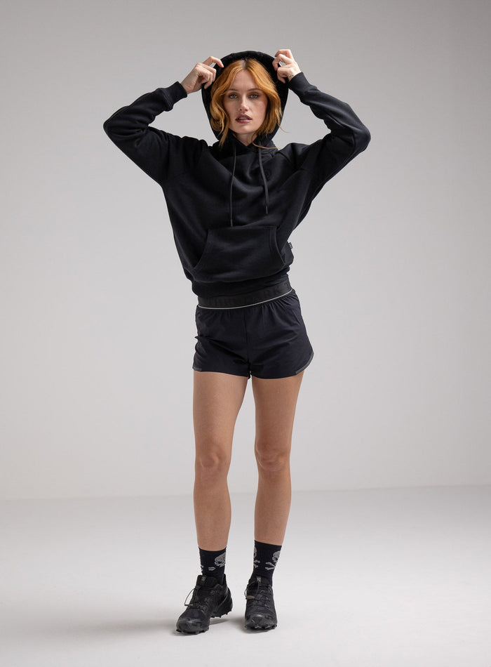 Miki Is 5ft 8" And Wears Size: S | Hem Studio Image Of Model Wearing Valor Hoody In Obsidian Black (SS Model)