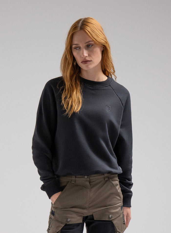 Miki Is 5ft 8" And Wears Size: S | Hem Studio Image Of Model Wearing Valor Jumper In Obsidian Black (SS Model)