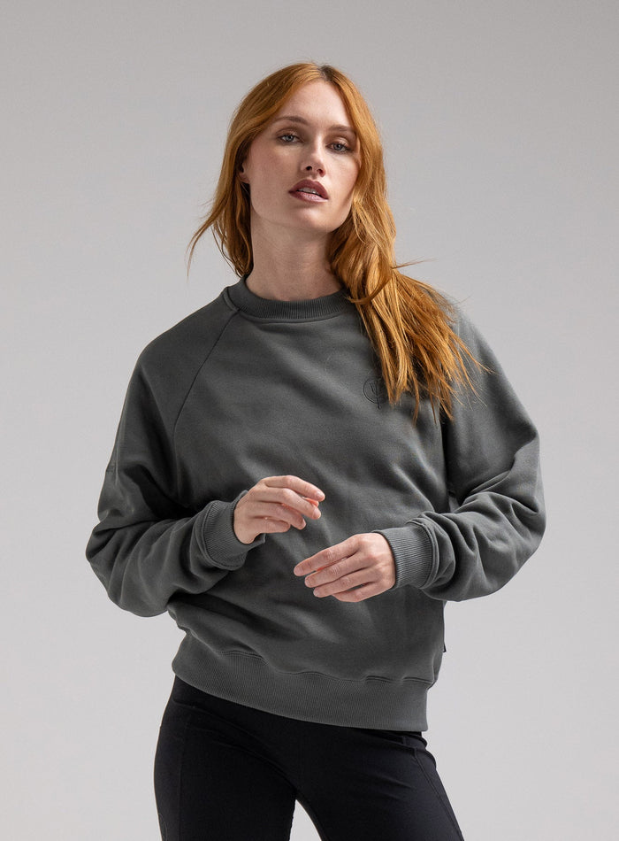Miki Is 5ft 8" And Wears Size: S | Hem Studio Image Of Model Wearing Valor Jumper In Urban Green (SS Model)