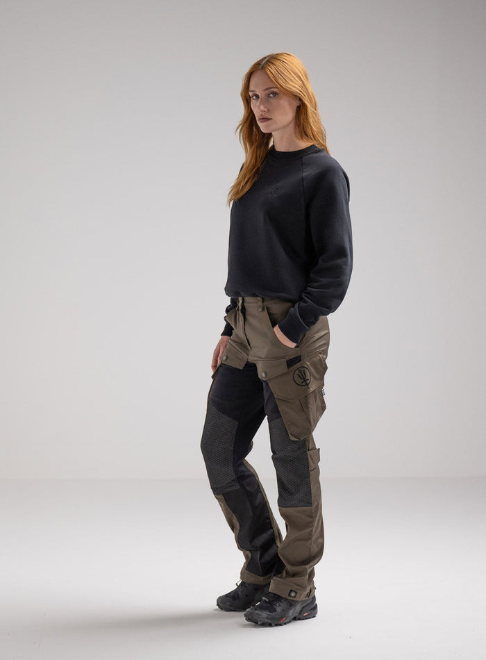 Miki Is 5ft 8" And Wears Size: S | Hem Studio Image Of Model Wearing Valor Jumper In Obsidian Black (SS Model)