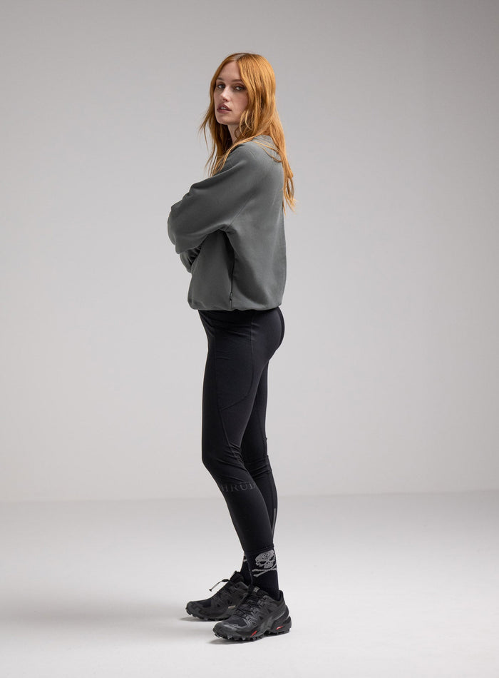 Miki Is 5ft 8" And Wears Size: S | Hem Studio Image Of Model Wearing Valor Jumper In Urban Green (SS Model)