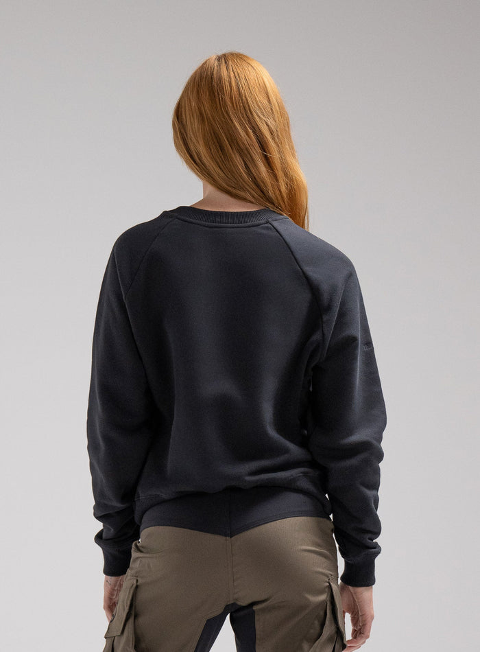 Miki Is 5ft 8" And Wears Size: S | Hem Studio Image Of Model Wearing Valor Jumper In Obsidian Black (SS Model)