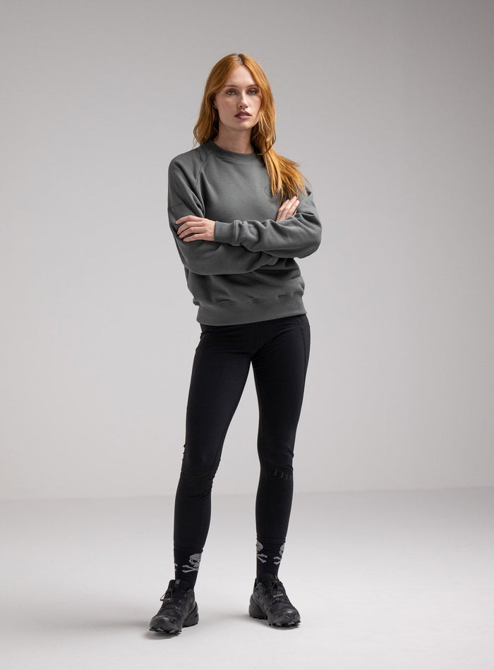 Miki Is 5ft 8" And Wears Size: S | Hem Studio Image Of Model Wearing Valor Jumper In Urban Green (SS Model)