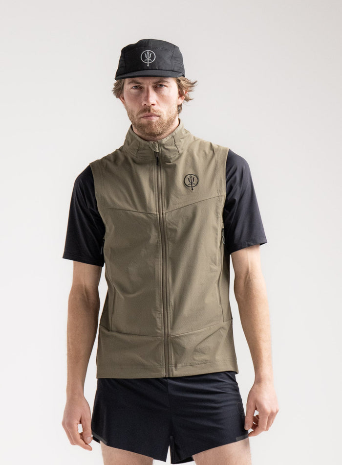 Rudie Is 6ft 2" And Wears Size: M | Hem Studio Image Of Model Wearing Veles Gilet In Olive Green (SS Model)
