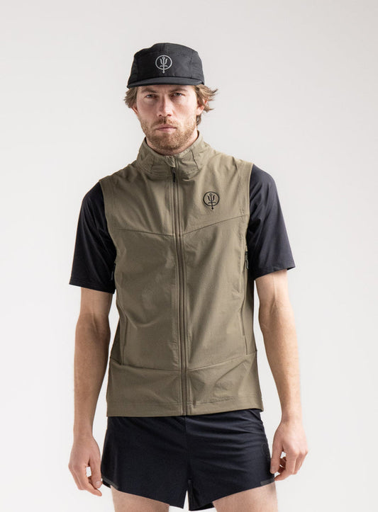 Rudie Is 6ft 2" And Wears Size: M | Hem Studio Image Of Model Wearing Veles Gilet In Olive Green (SS Model)