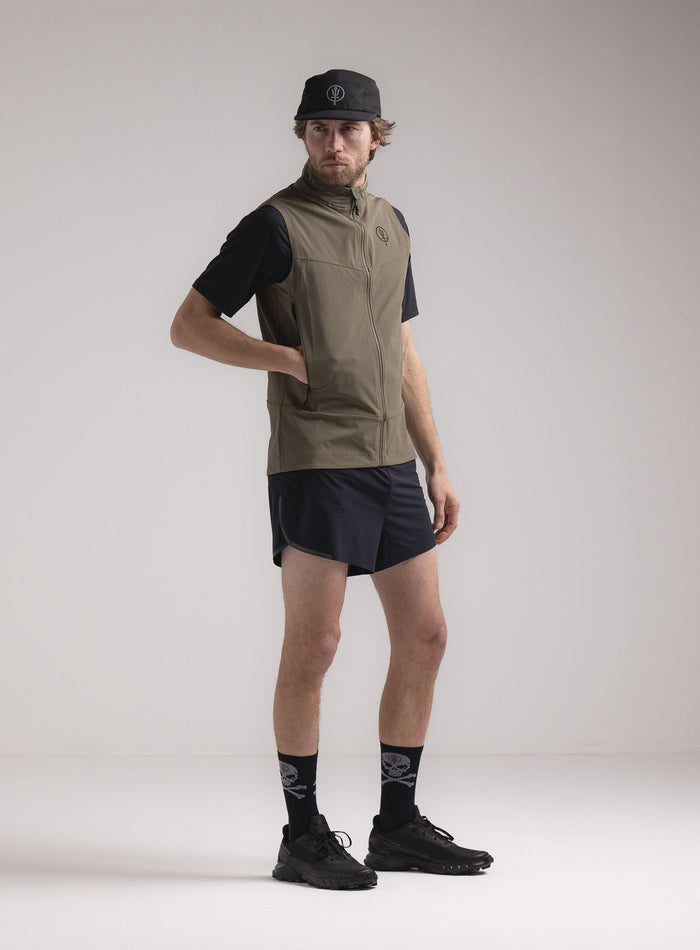 Rudie Is 6ft 2" And Wears Size: M | Hem Studio Image Of Model Wearing Veles Gilet In Olive Green (SS Model)