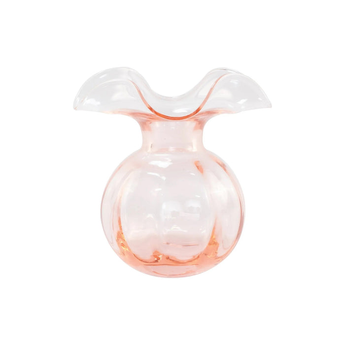The VIETRI Hibiscus Bud Vase Pink features clear glass with a pale pink tint and a wide, wavy flared rim, inspired by Tuscan artisan craftsmanship and Hibiscus glass designs. Set against a white background.