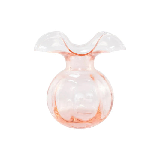 The VIETRI Hibiscus Bud Vase Pink features clear glass with a pale pink tint and a wide, wavy flared rim, inspired by Tuscan artisan craftsmanship and Hibiscus glass designs. Set against a white background.